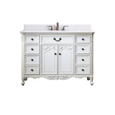 a white bathroom vanity with two sinks and drawers