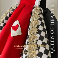 a close up of a dress made to look like a queen's gown with a red heart on it