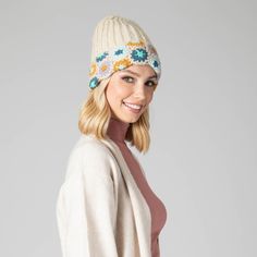 For cold weather with style, you can't beat this cozy Curb Crochet Beanie! With its adorable pastel floral accent, you'll look bright and cheery even when the weather isn't! Make winter a breeze with this hand-knit and cuffed beanie! Features: Color: PastelMaterials: 100% AcrylicSize: 57cmCold Weather Cream Crochet Hat For Winter, One Size, Cream Crochet Hat For Winter, Cream Winter Crochet Hat One Size, Fitted Crochet Hat For Spring, Casual Cream Crochet Hat For Winter, Casual Crochet Knit Hat For Spring, Casual Spring Crochet Hat One Size, Cream Adjustable Crochet Hat For Winter, Beige Bohemian Crochet Hat For Winter