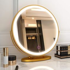 a round mirror sitting on top of a table