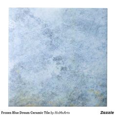 a blue and white marble textured background with yellow dots in the center, as well as text that reads frozen blue dream ceramic tile