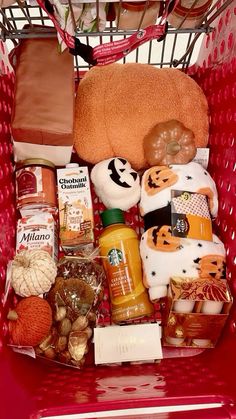 a red shopping cart filled with lots of food and condiments to make it look like halloween