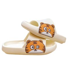 The Tiger Slides have cute, cartoon tigers on each variation! The EVA slides are comfortable and perfect for any age and gender. The white slide makes the orange tiger pop. They are fantastic for animal and tiger lovers everywhere! FEATURES: Style Open Toe Season Summer/ Spring Sole Flat Vamp material EVA COMFORTABLE MATERIAL: The Tiger Slippers are made of high-density material. These are light, soft, breathable, and waterproof, and their excellent flexibility and durability make them perfect for everyday wear. The modern features and attractive characteristics will never go out of style even if worn for years. SUPER NON-SLIP SOLE: The super comfy footwear features a thickened sole with an anti-slip texture design that provides excellent friction and just the right amount of support as yo Orange Non-slip Casual Slippers, Cartoon Style Sandals For Beach In Summer, Cartoon Style Sandals For Beach And Summer, Playful White Slippers For Summer, Playful White Open Toe Flip Flops, Cartoon Style Summer Beach Sandals, White Non-slip Slide Slippers, Playful White Flat Sandals, Playful White Slip-on Sandals