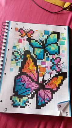 a notebook with an image of a butterfly on it