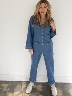 A loose fitting denim jumpsuit that is an easy go to outfit. With button front retail, v neckline, loose fitting sleeves, four front pockets and a single rear pocket. The Willie jumpsuit is lightweight and can be cuffed and paired with a sneaker for a casual everyday look that is always a favorite. 100% Cotton Model is wearing a size small and is 5'5", 135 lbs and a B cup. Fits true to size. 135 Lbs, B Cup, Easy Going, Casual Everyday, Denim Jumpsuit, Colored Denim, Leather Coat, Everyday Look, Midi Skirt