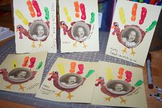 four handprinted turkeys are on the table with colored crayons around them