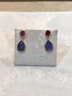 These exquisite Tanzanite fancy cut and pink tourmaline 18k earrings are handmade and one of a kind. Perfect for adding a touch of glamour to any look, they make a thoughtful gift, while also serving as a unique representation of Greek Jewelry. Tourmaline Gemstone Earrings In Fine Jewelry Style, Fine Jewelry Tourmaline Gemstone Earrings, Elegant Tourmaline Earrings With Gemstone Accents, Luxury Tourmaline Earrings As Gift, Luxury Tourmaline Earrings For Gift, Elegant Tourmaline Earrings With Natural Stones, Greek Jewelry, Fine Earrings, Pink Tourmaline