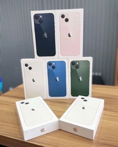 four new iphones are on display in their boxes