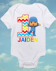 a baby bodysuit with the number one on it and an image of a cartoon character