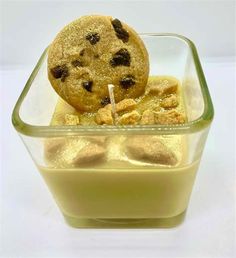 a cookie and ice cream dessert in a glass dish with a straw sticking out of it