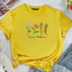 Raising Wildflowers Graphic T-Shirt Top Large - New With Tags - Soft And Stretchy - Size Large (Bust 43in Length 26in) Rs Trendy Crew Neck Tops With Plants Print, Casual Crew Neck Top With Plants Print, Yellow Plants Print Short Sleeve T-shirt, Yellow Short Sleeve T-shirt With Plant Print, Graphic Tee With Plant Print Crew Neck, Yellow T-shirt With Plant Print For Summer, Yellow Letter Print Top For Spring, Yellow Letter Print Tops For Spring, Yellow Floral Print Cotton T-shirt