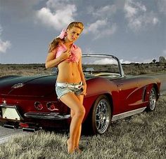 a woman standing next to a red sports car