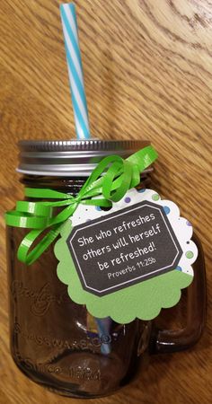 there is a mason jar with a straw in it and a tag on the lid