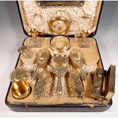 Black covered wooden case with original, cream-colored velvet and silk interior contents: a small tray, two glass bottles, a powder box on feet, an oval glass box, four brushes, a hand mirror, a round silver box on feet, a rectangular box on feet with curling tongs, two comb holders. All glass parts with star cut, silver parts in a smooth finish, framed by plastic ribbon garlands. All silver parts monogrammed and hallmarked. 925 silver hallmarks: master's sign 'w.c'- william comyns & sons ltd., Victorian Things, Vintage Boxes, Sewing Vintage, 1st Dibs, Fancy Things, Ribbon Garland