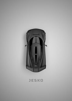 an overhead view of a black sports car on a gray background with the word jeske written below it