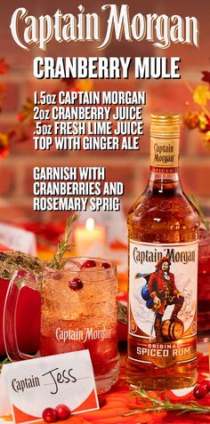 captain morgan cranberry mule with ginger ale and cranberries and rosemary syrup