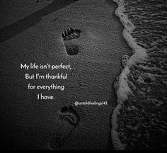 two footprints in the sand with an ocean and beach behind them that says, my life isn't perfect but i'm thank for everything i have