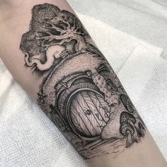 a man's arm with a black and white image of a hobbot