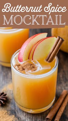 two glasses filled with apple cider cocktail and cinnamon sticks