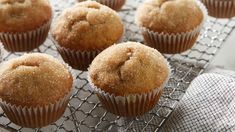 several muffins are sitting on a cooling rack