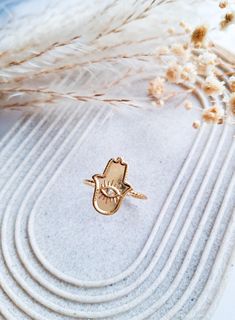 Hamsa Hand Gold Ring. Stainless Steel Gold Vintage Inspired Adjustable Hamsa Hand Amulet Ring With Tiny Diamante Detail. Cute Statement Ring Gift For Her The ring is size UK S or Size US 9 - Can be adjusted, however size will remain around this size.  The ring will come in a high quality black gift box with flocked foam. They will also be gift wrapped with ribbon free of charge. Perfect for gift giving! If you have any questions about this product or any other items in our shop then please get in touch! Please leave all gift messages in the gift message box at checkout. Orders will be sent out using Royal Mail within 1-3 business day Adjustable Gold Ring, Protection Ring, Gold Jewelry Gift, Gold Hamsa, Black Gift Boxes, Hamsa Hand, Black Gift, Jewellery Gift, Rings For Her