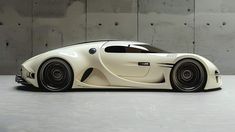 a white sports car parked in front of a concrete wall with black rims on it