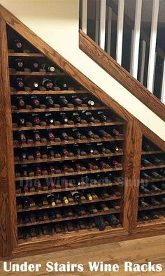 under stairs wine racks are built into the wall