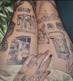 two women with tattoos on their legs and one has her hand on the other's leg