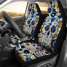 the interior of a car with skulls and flowers on it