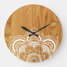 a wooden clock with an intricate design on it