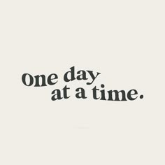 one day at a time text on white background with black and white image in the middle