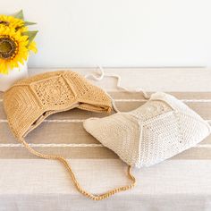 IN STOCK FAST SHIPPING FROM LOS ANGELES Introducing the Elena Handbags Boho Crochet Crossbody Bag, a fusion of bohemian style and intricate hand-knitting. Made with soft cotton and linen lining, this bag features a magnetic button closure, an inside pocket, and a long strap for versatile wear. Embrace the free-spirited aesthetic and add a touch of artistry to your look. Size: W 13in x H 12in Strap drop length: 20in Magnetic button closure Inside pocket Designer Style ID: 8617 Cream Bohemian Hobo Bag For Summer, Summer Bohemian Cream Hobo Bag, Bohemian Beige Bags With Open Weave, Festival Rectangular Shoulder Bag With Braided Handles, Bohemian Summer Pouch Hobo Bag, Bohemian Summer Hobo Bag In Pouch Shape, Summer Bohemian Hobo Pouch Bag, Bohemian Straw Pouch Bag With Adjustable Strap, Bohemian Cream Hobo Bag For The Beach