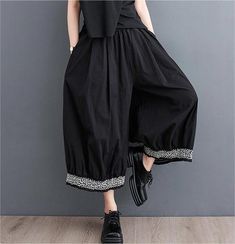 Details: Type: Women Loose Color Block Ruffled Wide Leg Pants Material: Cotton Pants Length: Capri Pants Waist Type: High Waist Color: Black Style: Loose, Retro Size Hip Waist(min) cm inch cm inch One Size 134 52.76 62 24.41 Baggy Ankle-length Summer Bottoms, Baggy Ankle-length Summer Pants, Casual Black Ankle-length Pants, Spring Non-stretch Ankle-length Culottes, Baggy High-waisted Harem Pants For Spring, Elegant Summer Harem Pants With Pockets, Black Summer Ankle-length Culottes, Black Wide Leg Bottoms For Spring, Baggy Black Summer Bottoms