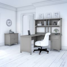 a white chair sitting in front of a desk with a book shelf on top of it