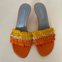 Lambertson True Sandals They Have Orange And Yellow Ruffles On Top With 3 Inch Heels. Size 7. 10/10 Condition Yellow Sandals For Formal Spring Events, Yellow Formal Sandals For Spring, Elegant Yellow Sandals For Summer, Yellow Evening Sandals For Spring, Yellow Summer Evening Heels, Elegant Yellow Heels For The Beach, Elegant Yellow Heels For Beach, Yellow Round Toe Sandals For Evening, Elegant Orange Sandals For Summer