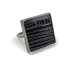 Square and modern and textural ring of black on black kiln fired enamel, gloss black against matte ground, set into oxidized sterling silver with a squared shank, .8" square, size 7.5 Luxury Black Enamel Ring As Gift, Contemporary Black Jewelry With Oxidized Finish, Black Brutalist Jewelry As A Gift, Oxidized Silver Rings, Kiln Firing, Fire Glass, Black On Black, Enamel Ring, Oxidized Sterling Silver