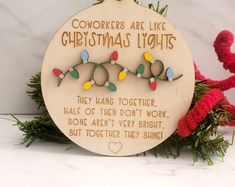 a wooden ornament with christmas lights on it