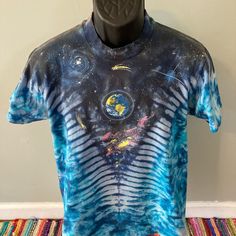 a t - shirt with an image of the earth on it