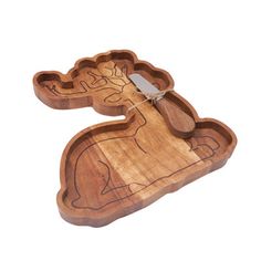 a wooden cutting board with an animal design on it