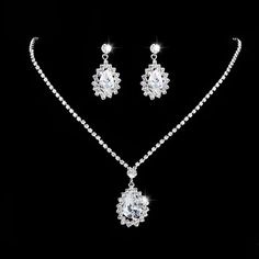 Boutiques Bridal Set- Raise Your Look with a Hint of Style ﻿The unique water drop design of this jewelry set is sure to turn heads, making it the perfect choice for brides and bridesmaids alike. Whether you're looking to make a statement at your wedding or simply add a touch of elegance to your special day, this exquisite jewelry set is sure to do the trick. And, with its high-quality materials and beautiful craftsmanship, it will last for years to come, making it a treasured keepsake for any br Crystal Wedding Jewelry, Wedding Jewelry Set, Studded Necklace, Silver Jewellery Sets, Wedding Bridal Jewellery, Long Pendant Necklace, Silver Plated Necklace, Long Pendant, Crystal Necklace Pendant