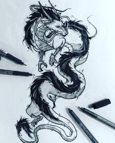 an ink drawing of a dragon with its mouth open and eyes closed, surrounded by pencils