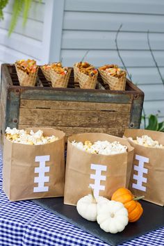 some paper bags filled with food on top of a table