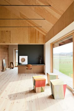 an open room with wooden walls and flooring