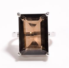 100% Natural Gemstone, Smokey quartz ring, Rectangle Shape, Size 16×12 MM, Material    925 Sterling silver,  Stone      :- Natural Smokey quartz  Size         :- 16x12 MM  Shape     :- Rectangle Material  :- 925 Sterling silver ❁❁ 𝐉𝐞𝐰𝐞𝐥𝐫𝐲 𝐂𝐞𝐫𝐭𝐢𝐟𝐢𝐜𝐚𝐭𝐞 ❁❁ ↣ KHJewels branded authenticate Jewellery Certificate comes with the authenticity of Metal, Moissanite, and Gemstone combination. ↣ The certificate comes with Limited Lifetime Warranty details. ↣ Listed Jewellery comes with a branded Jewellery Certificate on request. ↣ If you want to get the certificate with your ordered jewellery then please contact me within 72 hours of your order placed. ↣ The certificate is Chargeable. ❃ 𝐒𝐩𝐞𝐜𝐢𝐚𝐥𝐭𝐲 𝐚𝐧𝐝 𝐍𝐨𝐭𝐞𝐬 ↣ Customised Designer Jewellery. ↣ Offer All cuts which you dr Smokey Quartz Jewelry, Branded Jewellery, Quartz Jewelry, Silver Rings Handmade, Quartz Ring, Smokey Quartz, Ring Engagement, Jewelry Ring, Vintage Ring