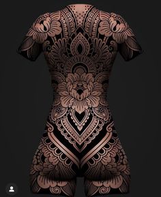 the back of a woman's body with intricate designs on it