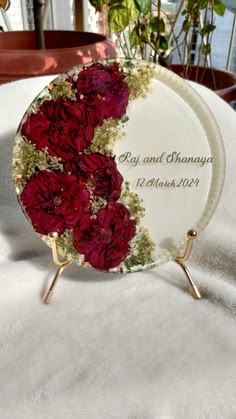 a plate with flowers on it sitting on a table