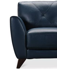 a dark blue leather chair with wooden legs