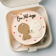 a cake in the shape of a dog and a baby's first birthday present