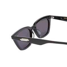 a pair of sunglasses with black frames and grey lenses