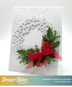 a christmas card with holly and red ribbon